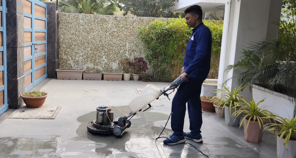 housekeeping boy using Floor cleaning machine
